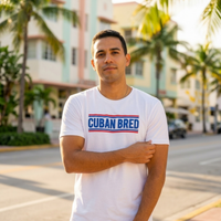 Cuban Bred™ t-shirt styled with Miami Beach swim shorts, male model – Cuban American graphic tee, Miami gift by Martha of Miami