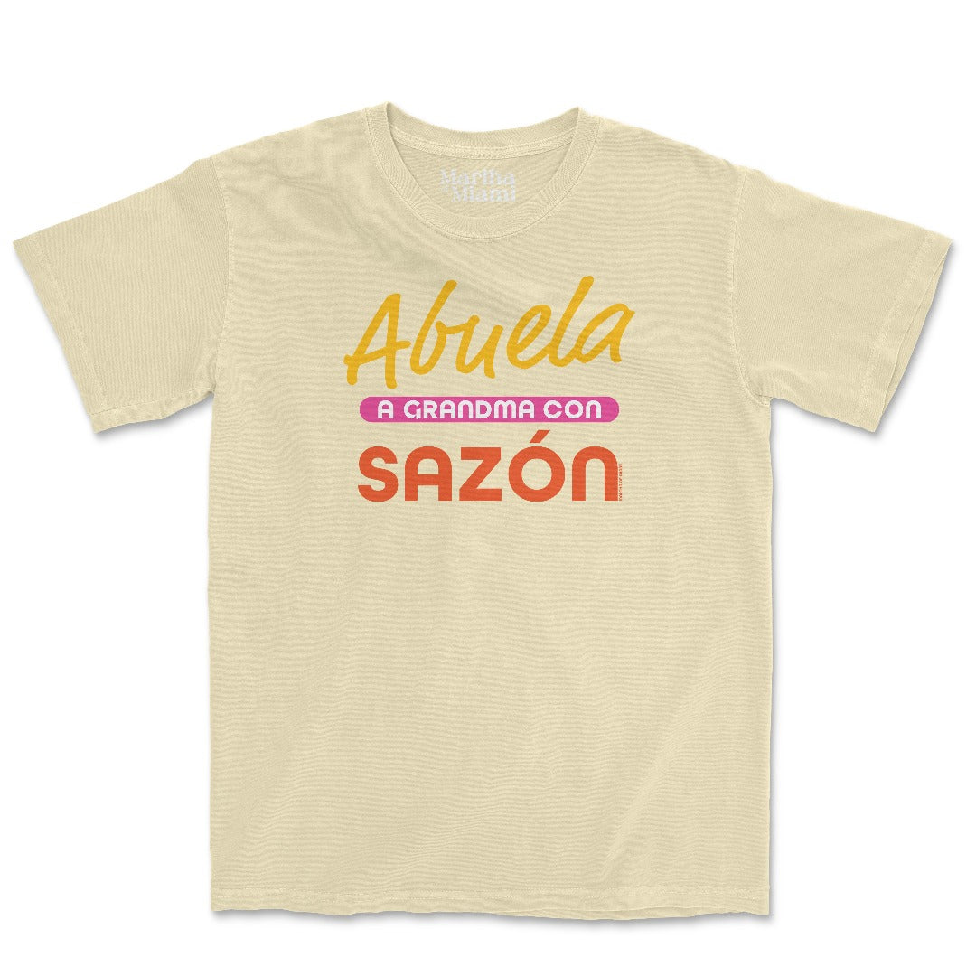 Abuela, a Grandma con Sazón t-shirt featuring Adobo seasoning design in a yellow color