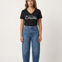Raised on Croquetas women's v-neck t-shirt, model photo – Cuban American graphic tee, Miami gift by Martha of Miami