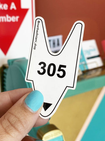 an image of deli take a ticket with the number 305 to represent Miami's area code