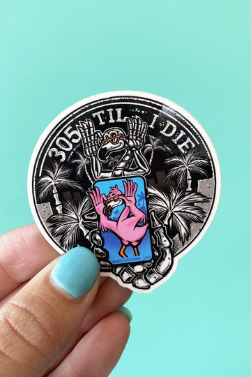 an image of sticker with a graphic of a skeleton flamingo getting its picture taken with the text saying 305 til i die.