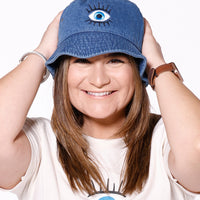 Martha of Miami Wearing Mal De Ojo Evil Eye Bucket Hat