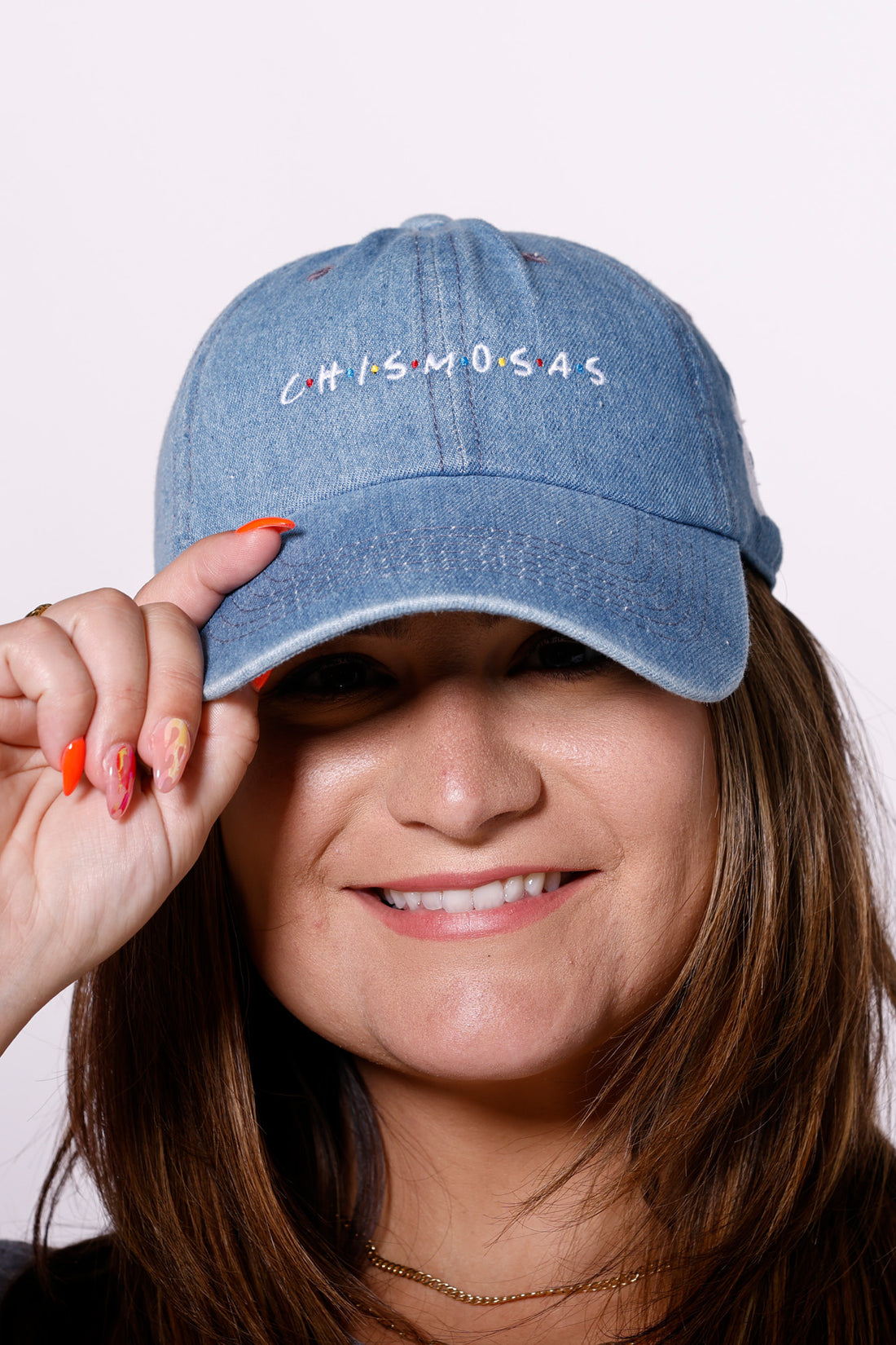 Martha of Miami Wearing Chismosas denim hat