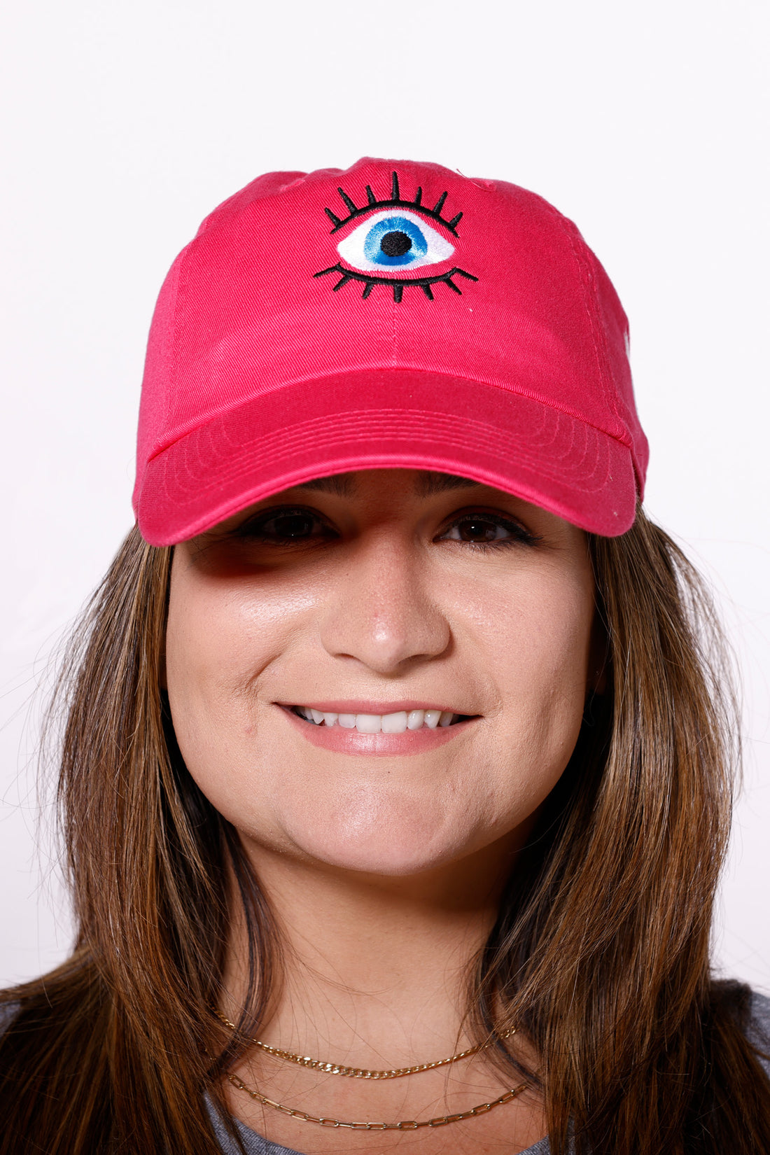 Martha of Miami wearing denim Mal de Ojo Hat for Protection Evil Eye Hat Gorra de Mal de Ojo